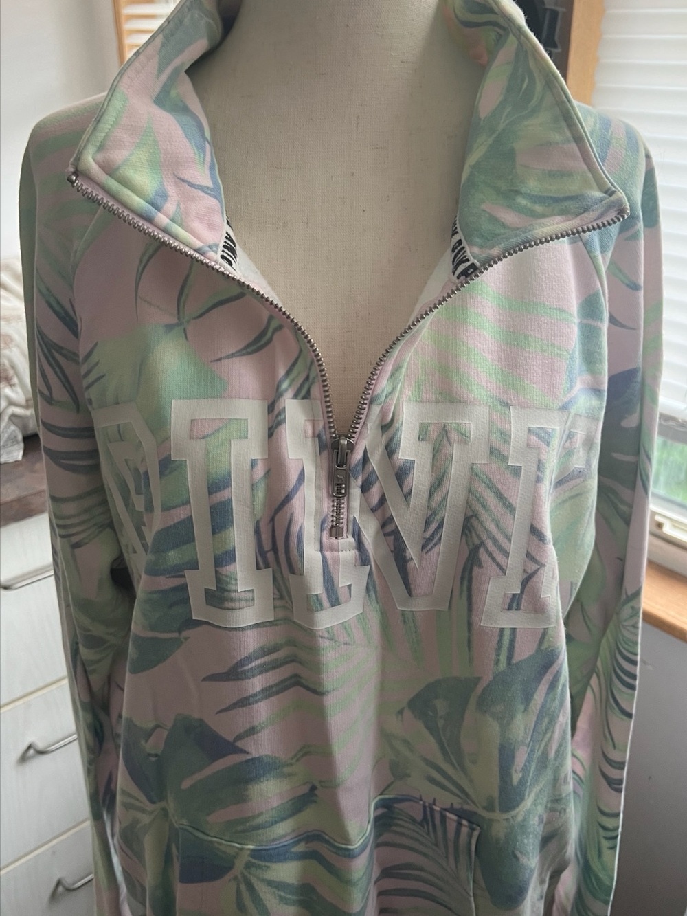 PINK Women’s Tropical-Leaf Sweatshirt with 3 quarter zip collar. Size medium.